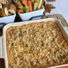 a casserole dish with carrots, celery and mushrooms