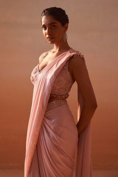 Blush pink sleeveless halter neck blouse with 3D flora, resham and stone embellishments. Paired with an embroidered waistband pre-draped shimmer satin saree. - Aza Fashions Halter Neck Blouse, Saree Women, Halter Neck Blouses, Embroidery 3d, Pink 3d, Drape Saree, Satin Saree, Embellished Blouse, Aza Fashion