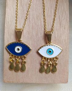 evil eye necklacefortune tellergood luck necklaceevil eye gold charmevil eye golddainty gold necklacegold eye pendantgifts for herdainty necklaceDelicate NecklaceBirthday giftgold necklacelayered necklaceEvil eye charm pendant is made of 24k gold plated  steel and is handpainted!Customize your necklace by choosing the length of it (35 - 85 cm) and between 2 Evil eye colors! Everything is handmade from the scratch with love and care.All the parts are waterproof,nickel free and antiallergic .Evil Gold Plated Evil Eye Jewelry Gift, Gold Plated Evil Eye Jewelry As Gift, Gold-plated Evil Eye Jewelry As Gift, Gold Dangle Jewelry With Evil Eye, Adjustable Teardrop Evil Eye Jewelry, Gold Plated Evil Eye Charm Necklace Gift, Gold Evil Eye Necklace As Gift, Gold Symbolic Evil Eye Charm Necklaces, Gold Symbolic Charm Necklaces With Evil Eye