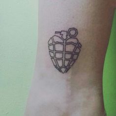 a heart shaped tattoo on the ankle that is made up of squares and cubes