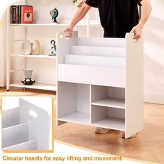 a man standing next to a white book shelf