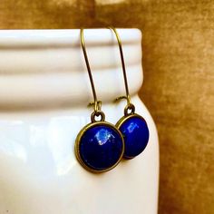 Excited to share this item from my #etsy shop: Lapis Lazuli Gemstone Dangling earrings, round, 12mm, Bronze settings, latch-back, natural, lapis stone, blue, semi-precious, handmade, USA #latchback #circle #bohohippie #earwire #lapislazuli #bronze #blue #stone Staple Earrings, Turquoise Gemstone Earrings, Great Gifts For Women, Earring Trends, Gemstone Cabochons, Earring Display, Gemstone Studs, Black Earrings, Small Earrings