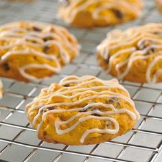 chocolate chip cookies with icing on a cooling rack