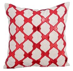 a red and white pillow on a white background