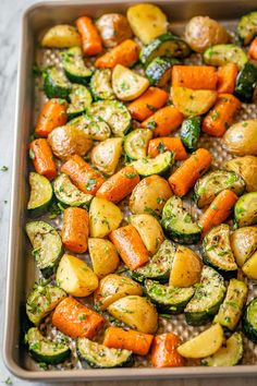 a pan filled with cooked vegetables on top of a table