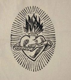 a drawing of a heart with flames in the middle