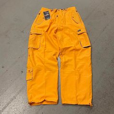 Vintage Baggy Y2k Urban Wide Leg Yellow Rave Windbreaker Skater Pants 2000s Cool J Brand Size 2xl (Adjustable Waistband) New With Tags Shipping Is $8 Measurements Waist: 19 Inches (38 Inch Waist) Inseam: 30 Inches Rise: 13 Inches Leg Opening: 10 Inches Dm Me To Bundle Items For A Discounted Price !! Yellow Baggy Pants, 90s Style Cargo Pants For Fall Streetwear, 90s Style Cargo Pants With Side Pockets For Streetwear, 90s Style Cargo Pants For Streetwear With Side Pockets, Y2k Parachute Pants For Streetwear In Fall, Y2k Parachute Pants For Fall Streetwear, 90s Parachute Pants With Cargo Pockets, 90s Relaxed Fit Cargo Pants For Streetwear, Yellow Pants With Pockets For Streetwear