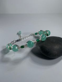 "Beautiful green Aventurine gemstone bracelet. Silver plated, adjustable. 6\"-8\" You receive the bracelet pictured with the coin purse." Green Amazonite Bracelet, Adjustable Aventurine Beaded Bracelets, Adjustable Turquoise Aventurine Jewelry, Adjustable Aventurine Bracelet Jewelry, Adjustable Aventurine Bracelet, Handmade Aventurine Crystal Bracelet Gift, Handmade Aventurine Bracelet, Silver Aventurine Bracelet Jewelry, Handmade Elegant Aventurine Bracelets