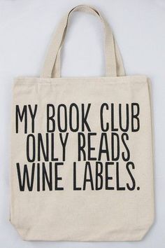 a book club tote bag with wine labels printed on the front and back side