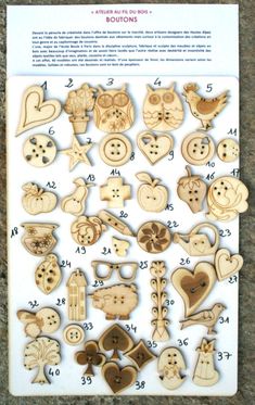 wooden buttons with numbers and pictures on them in the shape of hearts, birds, and other things