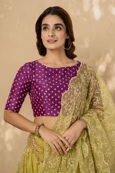 Lime green lehenga with layered hemline and embroidered trim. Comes with embroidered purple blouse and dupatta.
Component: 3
Embroidery
Neckline: Round
Sleeve Length: Half
Fabric: Cotton, Chanderi and Organza
Color: Green,Purple
Dupatta with embroidered and scalloped edge
Closure: Side tie up
Note: Accessory on the waist worn by the model is not for sale
Note: Yellow lehenga set worn by the other model is not for sale - Aza Fashions Purple Blouse Piece With Dori Work For Reception, Semi-stitched Purple Blouse For Reception, Purple Semi-stitched Blouse For Receptions, Purple Semi-stitched Blouse Piece For Reception, Purple Blouse For Diwali Reception, Festive Purple Blouse With Dupatta, Festive Purple Blouse For Reception, Unstitched Purple Blouse For Eid, Eid Purple Blouse With Cutdana Embroidery