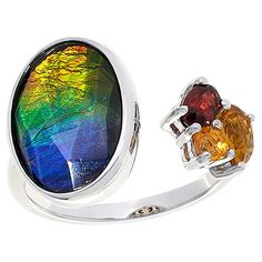 Discover the radiant allure of the Canadian wilderness with this exquisite Sterling Silver Oval Ammolite and Multigem Ring by Kenneth Bradley. A masterpiece of vibrant colors and intricate design, this ring showcases the rare and captivating Ammolite, a gemstone found only in Alberta, Canada.

- Material: Sterling Silver with Rhodium Plating
- Gemstones: Ammolite/Quartz Triplet, Yellow Citrine, Orange Opal, Red Garnet
- Dimensions: Approx. 13/16"L x 7/8"W x 15/16"H; Shank 1/8"W
- Size: 9
- Color Fine Jewelry Multicolor Cabochon Gemstones, Multicolor Cabochon Gemstones Fine Jewelry, Multicolor Cabochon Gemstones For Fine Jewelry, Multicolor Cabochon Rings For Formal Occasions, Luxury Multicolor Cabochon Rings, Elegant Multicolor Cabochon Rings, Formal Multicolor Cabochon Rings, Fine Jewelry With Polished Finish In Multicolor, Multicolor Natural Stone Rings For Anniversary