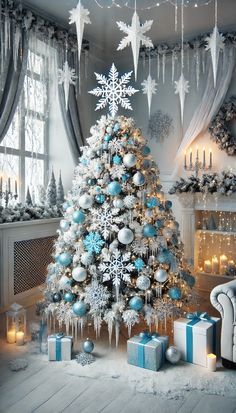 a decorated christmas tree with blue and silver ornaments