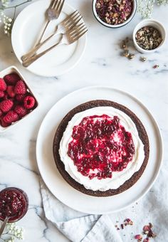 a dessert with raspberry sauce and whipped cream