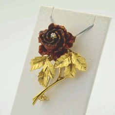 "The way to a ladies heart. An 18kt yellow gold and enameled rose brooch. She will love the combination of 18 kt gold and red enamel. The rose petals sport a prong set round diamond mounted in the center weighing approx. 0.02ct., and textured detail to the leaves. Length 1.5\". Weight 11.7 grams. This is the one. The perfect gift. Don't let it slip away. There is only one in stock. I always try to ship within one hour of receiving your order. If it's late, I'll ship it the next morning (unless i Rose Brooch, Diamond Brooch, Brooch Vintage, Wedding Anniversary Gift, Gold Brooches, Star Jewelry, Gold Flower, Anniversary Gift For Her, Gold Enamel