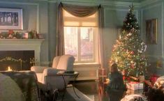 a living room filled with furniture and a christmas tree