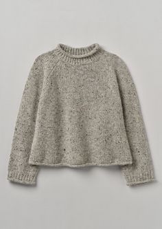 the sweater is knitted and ready to be worn for fall or winter, with buttons on the collar