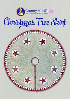 a christmas tree skirt with red and white stars on the bottom, hanging from a metal pole