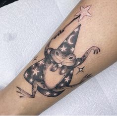 a monkey with a party hat and stars on his leg is shown in this tattoo design