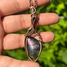 A dark purple and blue labradorite cabochon wrapped in solid antiqued copper wires. Available as a solo pendant, or with a matching solid antiqued copper chain. CHAIN LENGTH: If you don't see your desired chain length in the options above, feel free to add it in the "note to seller" section at checkout.  (example: "15 inch chain please")  Message me if you prefer a chain over 32 inches.  PACKAGING: All pieces are re-polished before they are shipped, and arrive in a simple gift box, ready to be gifted! (Or kept forever!)  JEWELRY CARE: Copper will naturally darken and antique over time, however it is very easy to polish with a jewelry polishing cloth, steel wool, or you can even polish copper jewelry with the ketchup in your fridge! If you need any help with caring for and maintaining your Bronze Wire Wrapped Labradorite Necklaces, Bronze Labradorite Wire Wrapped Necklaces, Wire Wrapped Cabochon, Wire Wrapped Crystal Pendant, Wire Wrap Cabochon, Special Occasion Jewelry, Simple Gift, Wire Wrapping Crystals, Forever Jewelry