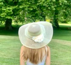 "Wonderfully wide brim hat, in a beautiful classic style. This hat dates to the 1950s or early 1960s. It is decorated with small white silk millinery flowers and white ribbon. Measurements: This hat would work well for any hat size as it's meant to sit on top of one's head.  Its measures around the outside 56 cm / 22 inch Condition: This hat is in a clean and good vintage condition. The only thing is that the flowers are a bit flattend (maybe it could be steam back?) The beauty of vintage is tha Summer Beach Cloche Fascinator, Cream Flat Brim Straw Hat For Garden Party, Cream Cloche Hat For Summer Church Events, Summer Cream Cloche Hat For Church, Spring Curved Brim Hat With Handmade Flowers, Spring Hat With Handmade Flowers And Curved Brim, Spring Hats With Handmade Flowers And Curved Brim, Chic Cloche Fascinator For Beach, Chic Beach Cloche Fascinator