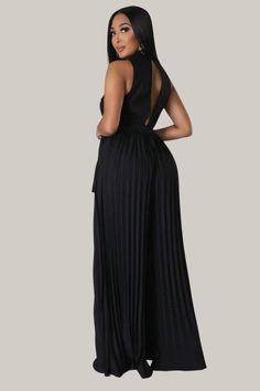 Incorporate sophistication and exclusivity into your wardrobe with this luxurious Button Front Pleated Hem Belted Pleated Wide Leg Jumpsuit. Boasting a lapel neckline and a high waistline, this garment offers a tasteful and elegant fit, while the double button and pleated details elevate its style. The slight stretch fabric provides comfort and versatility, making it the perfect addition to your premium collection. 95% Polyester, 5% Elastane Model is wearing size small Please allow 3-5 business Elegant V-neck Jumpsuits And Rompers For Going Out, Elegant Sleeveless Jumpsuits And Rompers For Night Out, Elegant Sleeveless Jumpsuits For Night Out, Elegant Fitted Solid Color Jumpsuits And Rompers, Chic Sleeveless Pleated Jumpsuits And Rompers, Elegant High-waist Jumpsuits And Rompers For Going Out, Elegant High Waist Jumpsuits For Going Out, Elegant High-waist Jumpsuits For Going Out, Elegant Evening Jumpsuits And Rompers In Solid Color