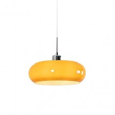 a yellow light hanging from a ceiling fixture