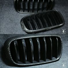 the front and rear grilles of a car are shown in black carbon fiber material