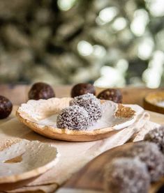 some food is sitting on a table with other foods in the back ground and trees in the background