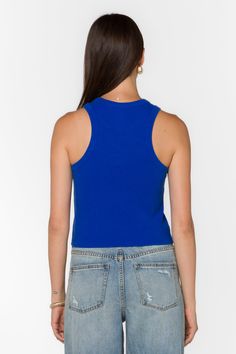 The Weston Top features a ribbed knit and racerback tank design. Perfect for warm weather, this top provides both comfort and style. Material: 95% Cotton and 5% Elastane Machine Wash Cold Color: Dazzling Blue Model is 5'9" and wearing a size S Imported Trendy Blue Top With Ribbed Neckline, Trendy Blue Tops With Ribbed Neckline, Blue Tank Top For Spring, Blue Ribbed Scoop Neck Top, Trendy Blue Tank Top, Casual Tank Top With Ribbed Neckline, Blue Ribbed Tank Top For Summer, Basic Blue Tank Top, Blue Sporty Tank Crop Top