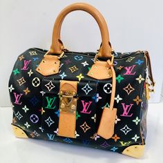 Overall Condition: Gently Used Exterior Condition: Gently Used Interior Condition: Gently Used Designer: Louis Vuitton Material: Black Multicolore Coated Canvas With Vachetta Leather Includes: Leather Clochette And Two Keys And Dust Bag Measurements: 12.5" L X 7.2" W X 8" H Exterior Pockets: One Outer Pocket With S-Lock Buckle Interior Pockets: One Flat Pocket Handles: Double Rolled Leather Handles Handle Drop: ?4" Closure/Opening: Single Zip Closure Interior Lining: Grey Alcantara Lining Hardwa Travel Bags With Branded Hardware In Multicolor, Multicolor Travel Bags With Branded Hardware, Multicolor Monogram Canvas Top Handle Shoulder Bag, Designer Multicolor Shoulder Bag With Branded Hardware, Multicolor Top Handle Bag With Branded Hardware, Luxury Multicolor Monogram Canvas Shoulder Bag, Designer Multicolor Monogram Canvas Bag, Daily Use Multicolor Monogram Canvas Bag, Multicolor Rectangular Monogram Canvas Bag