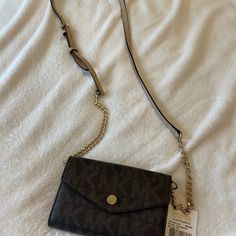 Brand New With Tag Included Used Once. Wallet/Crossbody/Iphone Case, Brown Monogram Michael Kors Wallet With Mobile Phone Bag, Brown Crossbody Wallet On Chain For Travel, Crossbody Wallet On Chain With Branded Hardware, Brown Crossbody Wallet On Chain With Removable Pouch, Brown Crossbody Wallet On Chain, Michael Kors Mercer, Mk Purse, Pink Crossbody Bag, Bags Michael Kors