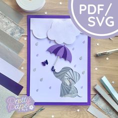 a purple and white card with an umbrella