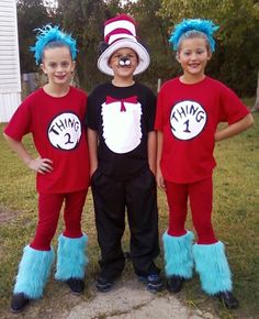 three children in cat in the hat costumes posing for a photo with their blue hair