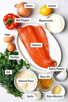 the ingredients to make salmon on a white plate