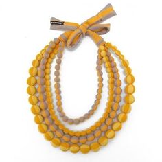 MARIMEKKO Statement Necklace, Fabric Bead Necklace in fabric bag, Finnish design 48 cm 19 in. Gorgeous fabric bead statement necklace by Finnish designer brand Marimekko. Striped cotton jersey fabric in orange, red, yellow and gray.  Length of the necklace is 90 cm ( 35.5"), Diameter of each bead is approx. 2 cm (1¾ inches) Good vintage condition. Marimekko Jewelry - Marimekko Design Whether topping off your Marimekko ensemble, or adding a pop of Finnish charm to an otherwise Marimekko-less outf Folk Design, Beaded Statement Necklace, Orange Fabric, Fabric Beads, Gorgeous Fabrics, Fabric Bag, Yellow Orange, Jersey Fabric, Pendant Necklaces