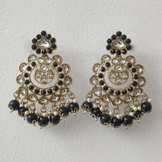 Experience the allure of our Black Indian Earrings collection, where elegance meets tradition. Elevate your style with the timeless charm of Kundan Chandbali Set, blending intricate craftsmanship with modern sophistication. Make a statement with our Suspended Beaded Indian Earrings, a perfect fusion of cultural richness and contemporary flair. Embrace the enchantment of our Pakistani Wedding Earrings, designed to add a touch of glamour to your special moments. Celebrate the artistry of Indian and Pakistani jewelry with this captivating assortment, each piece a testament to refined taste and cultural finesse. Materials: Brass, Pearl & Kundan ❋❋ Shipping Methods ❋❋ Standard Delivery - Take up to 8-14 business days (Worldwide). ❋❋ Please be aware that the colors, shades, and texture shown may Black Earrings Indian, Kundan Chandbali, Earrings Kundan, Pakistani Earrings, Black Indians, Golden Earrings, Pakistani Jewelry, Kundan Earrings, Indian Earrings