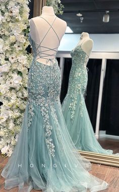 This elegant L2739 formal dress features a V-neckline and delicate spaghetti straps, accented with intricate lace applique. The tulle train adds a touch of sophistication. Perfect for formal events, this dress exudes effortless style and grace. Pastel Green Prom Dress, Light Green Prom Dress, Tulle Prom Dress Long, Corset Prom Dress, Tulle Train, Prom Themes, Long Fitted Dresses, Prom Inspo, Green Prom