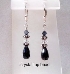 Dainty black onyx hand faceted teardrop earrings with crystal or freshwater pearl and sterling silver beads. Earrings are 1 1/2 inches long on sterling silver leverback ear wires. Great gift idea. Very elegant and dressy. Please select crystal or pearl option at checkout. Black Sterling Silver Jewelry With Pearl Drop, Black Teardrop Earrings With Pearl Drop, Black Teardrop Pearl Drop Earrings, Black Pearl Drop Teardrop Earrings, Black Drop Pearl Drop Jewelry, Black Pearl Drop Jewelry, Jewelry Charms Pendants, Onyx Jewelry, Beads Earrings