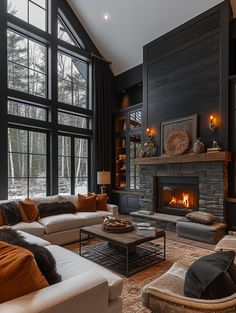 a living room filled with furniture and a fire place in the middle of it's walls