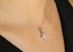 A token of faith. An 18k white gold cross showcases 11 stunning, princess cut diamonds, channel set. Each diamond is near colorless with 100% clean eye clarity. This pendant is a perfect size, not too small but big enough to be noticed and adored. This gorgeous diamond cross necklace is perfect for everyday use. It is an ideal gift to oneself or to someone you love! An inch 18K white gold cable chain is included with this diamond cross. Metal Purity: 18K White Gold (stamped behind bale: 18K) Set White Cubic Zirconia Crucifix Jewelry, Diamond White Cross Jewelry With Pave Setting, White Gold Crucifix Jewelry With Cubic Zirconia, White Gold Cubic Zirconia Cross Necklace For Anniversary, Brilliant Cut Cubic Zirconia Cross Necklace As Gift, White Diamond Accented Crucifix Jewelry, Cubic Zirconia Cross Necklace For Gift, White Gold Cubic Zirconia Crucifix Jewelry, Anniversary White Gold Cubic Zirconia Cross Necklace