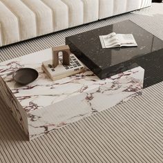 a marble coffee table sitting on top of a carpeted floor