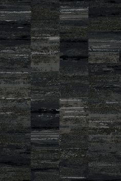 a black and gray area rug with different colors