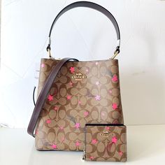 Nwt Coach Town Bucket Bag And Matching Snap Wallet In Signature Canvas With Disco Star Print In Pink Over Khaki Brown Coated Canvas, Brown Smooth Leather And Gold Hardware. This Convertible Bag Can Be Worn As A Shoulder Bag Or Crossbody Bag Or Held In Hand. Great For Daily Use Or A Gift. Msrp $616 = 428 + 188 Color: Im/Khaki Multi Pocketbook Details: Signature Coated Canvas And Smooth Leather Center Zip Compartment Snap Closure Handle With 8" Drop Detachable Strap With 20 1/2" Drop For Shoulder Pink Coach Bag As Gift, Pink Wallets For Daily Use With Dust Bag, Pink Square Shoulder Bag With Dust Bag, Pink Wallet With Dust Bag For Travel, Coach Town Bucket Bag, Coach Brown Bucket Bag, Chic Pink Wallets With Removable Pouch, Chic Pink Wallet With Removable Pouch, Brown Coach Bucket Shoulder Bag