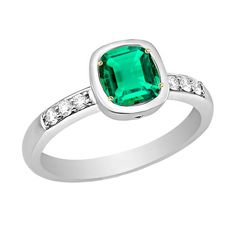 METAL SPECIFICATIONS Two Tone Gold 14K STONE SPECIFICATIONS Stone Name : Green Emerald and Diamond Stone Cut : Cushion and Round Cut Stone Details : There is one cushion cut green emerald stone in the center approx. 2.50 carats (Approx. Size 7 x 7 mm) with approx. 0.50 carats of small round diamonds on the sides. Crafted with natural earth mined stones. Color : Green/F Clarity : VS1 Quality : AAA Total : Approx. 3 Carats RING SPECIFICATIONS Appraised Value : $8,478.00 Size : 6.5 (Can ship in any size) Comes with Certificate Green Emerald Engagement Ring, 3 Carat Ring, Emerald Engagement Ring Green, Emerald Engagement, Emerald Stone, Emerald Engagement Ring, Green Emerald, 3 Carat, Natural Earth