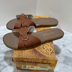 Brand New! Adjustable Brown Slides For Beach, Adjustable Brown Slide Sandals, Adjustable Brown Slides, Brown Closed Toe Slides For Beach, Brown Closed Toe Slides For The Beach, Brown Summer Flip Flops With Cushioned Footbed, Brown Flip Flops With Buckle Closure For Vacation, Brown Slide Flip Flops For The Beach, Brown Round Toe Slides For Vacation