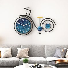 a living room with a couch, coffee table and clock on the wall above it