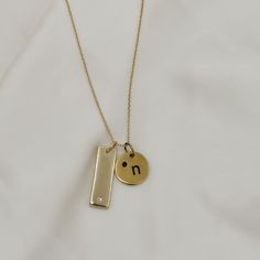 Give the gift of customization this holiday season with our gold filled tag necklace. Keep it simple with one tag or create a stacked looked and add multiple tags with different customizations to create a unique and timeless piece. Names, dates, etc. make the most thoughtful gift! These pieces are engraved in house and made to order! Include your customization in the note section on the cart page! Standard chain length is 17" with 2" of extender chain for adjusted length. Looking for a longer le Minimalist Yellow Gold Hand Stamped Charm Necklace, Everyday Gold Nameplate Charm Necklace, Everyday Gold Nameplate Charm Necklaces, Gold Customizable Charm Necklaces For Personalized Gift, Customizable Gold Charm Necklaces For Personalized Gift, Everyday Gold Nameplate Necklace, Everyday 14k Gold-filled Hand-stamped Charm Necklaces, Everyday 14k Gold-filled Hand Stamped Charm Necklaces, Gold Hand Stamped Necklace For Mom