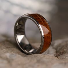 Wood from barrels used in real Tennessee whiskey casks has been inlaid into titanium on this whiskey oak wood ring. This wooden jewelry has an interesting history and makes for an excellent conversation piece. Perfect for whiskey enthusiasts, this whiskey barrel wood and titanium ring is in stock and ships in 3-5 days! Vintage Engagement Ring Settings, Leaf Engagement Ring, Rose Gold Morganite, Yellow Engagement Rings, Titanium Wedding Band, Tennessee Whiskey, Titanium Ring, Unique Diamond Rings, Sapphire Engagement Ring Blue