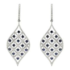 This is part of Chairish’s Fine Jewelry assortment.  Designer Blue Sapphire and Diamond Long Dangle Earrings to make a statement with your look. These earrings create a sparkling, luxurious look featuring oval cut gemstone. If you love to gravitate towards unique styles, this piece of jewelry is perfect for you.  PRODUCT DETAILS :-  > Material - 14K Solid White Gold > Gemstone - Blue sapphire  > Gemstone Weight - 1.88 ct > Gemstone Shape - Round  > Gemstone Pcs - 28   > Gemstone Size - 2.5 mm > Oval Pierced Earrings For Evening, Sapphire Earrings With Diamond Accents For Evening, Evening Earrings With Sapphire And Diamond Accents, Evening Sapphire Earrings With Diamond Accents, Exquisite Oval Diamond Cut Earrings, Elegant Sapphire Earrings With Diamond Cut, Modern Marquise Earrings For Formal Occasions, Fine Jewelry Marquise Earrings For Evening, Oval Diamond Earrings For Party